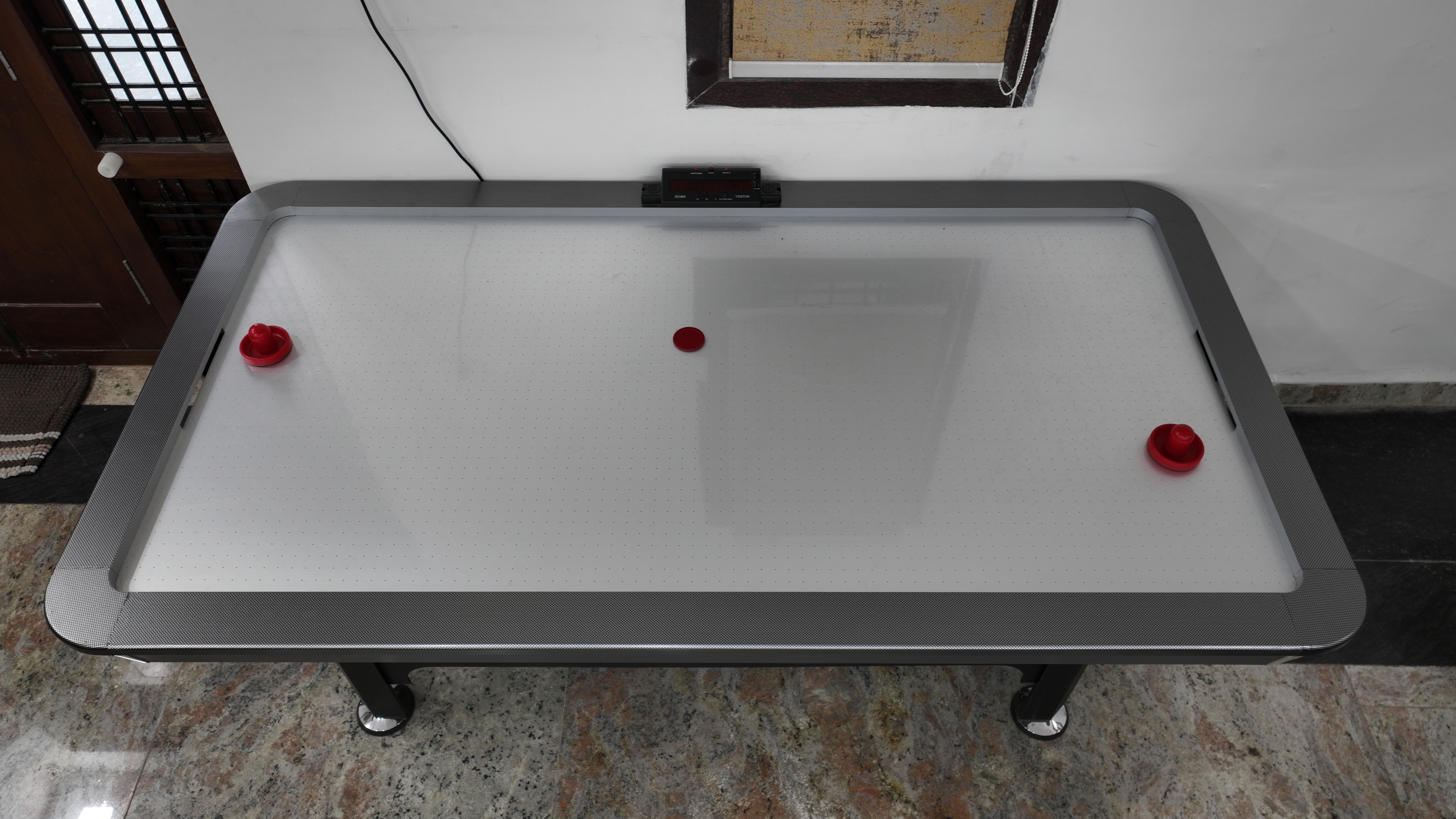 Indoor games room with professional air-hockey table